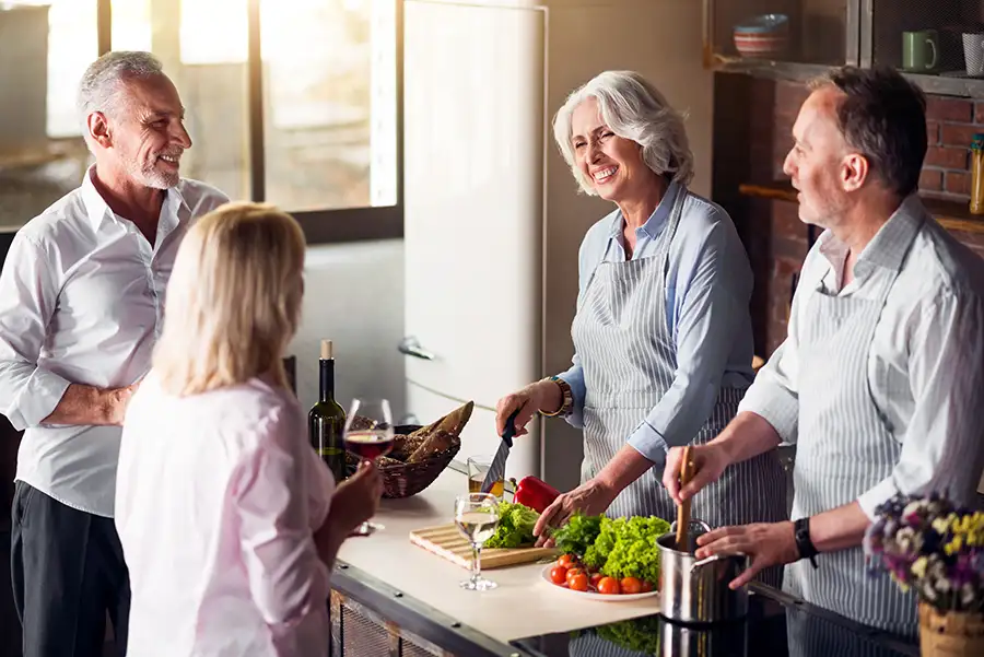 group of friends, older couple, cooking and making a meal together, enjoying retirement, on medicare - Collinsville, IL St. Louis Metro East