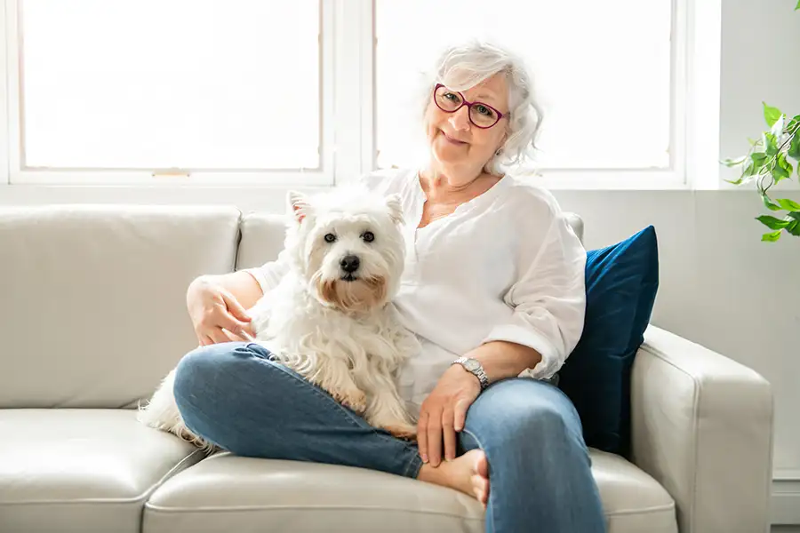 Older woman in her 60s, with a therapy dog, Medicare with mental health benefits - Collinsville, IL St. Louis Metro East